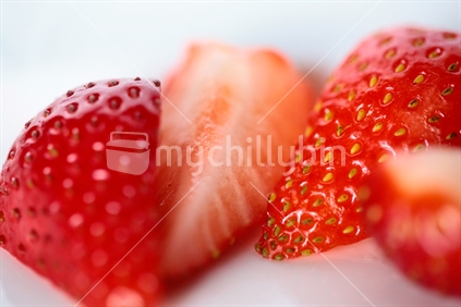 A strawberry cut into wedges.