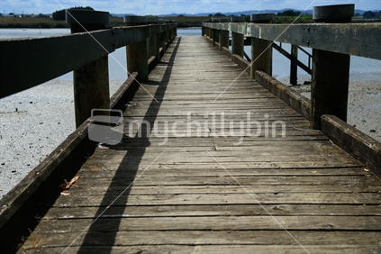 A wooden wharf bridge in Weymouth in Auckland.