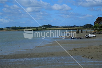 An inlet in Weymouth, Auckland on a summer's day.  With water, land, sky.