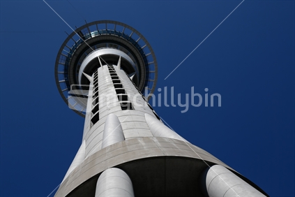 Looking up at the Auckland sky tower on a clear blue sky day.