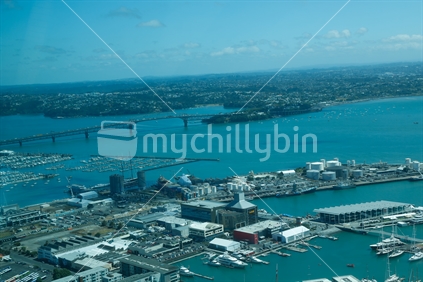 A view off Auckland city from the sky tower with the harbour bridge.