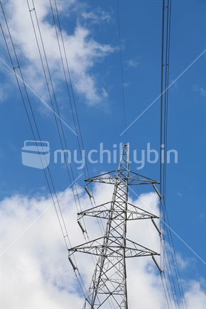 A pylon with wires in the sky.
