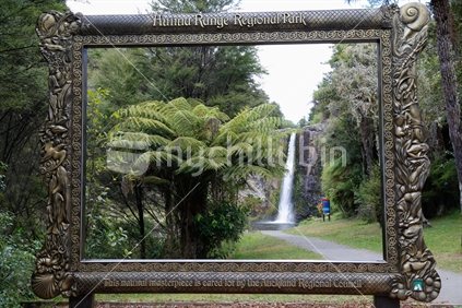 A picture frame in front of the Huna falls.