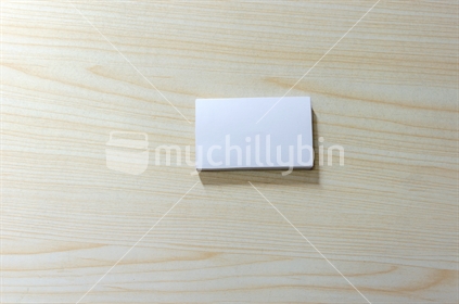 Blank Paper Mockup for Business Cards on wood.